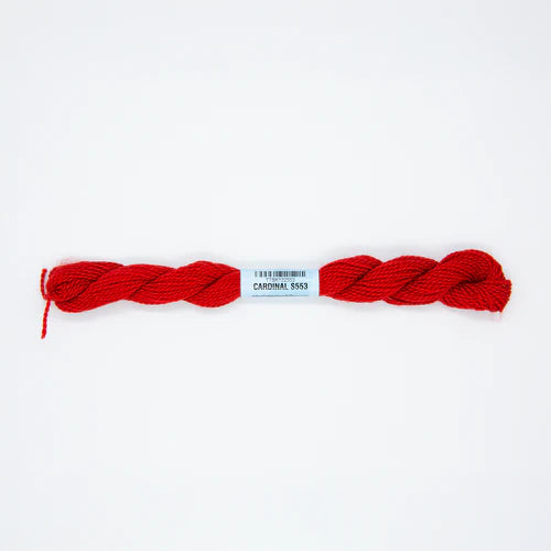 Red yarn with a label on a white background