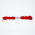 Red yarn with a label on a white background