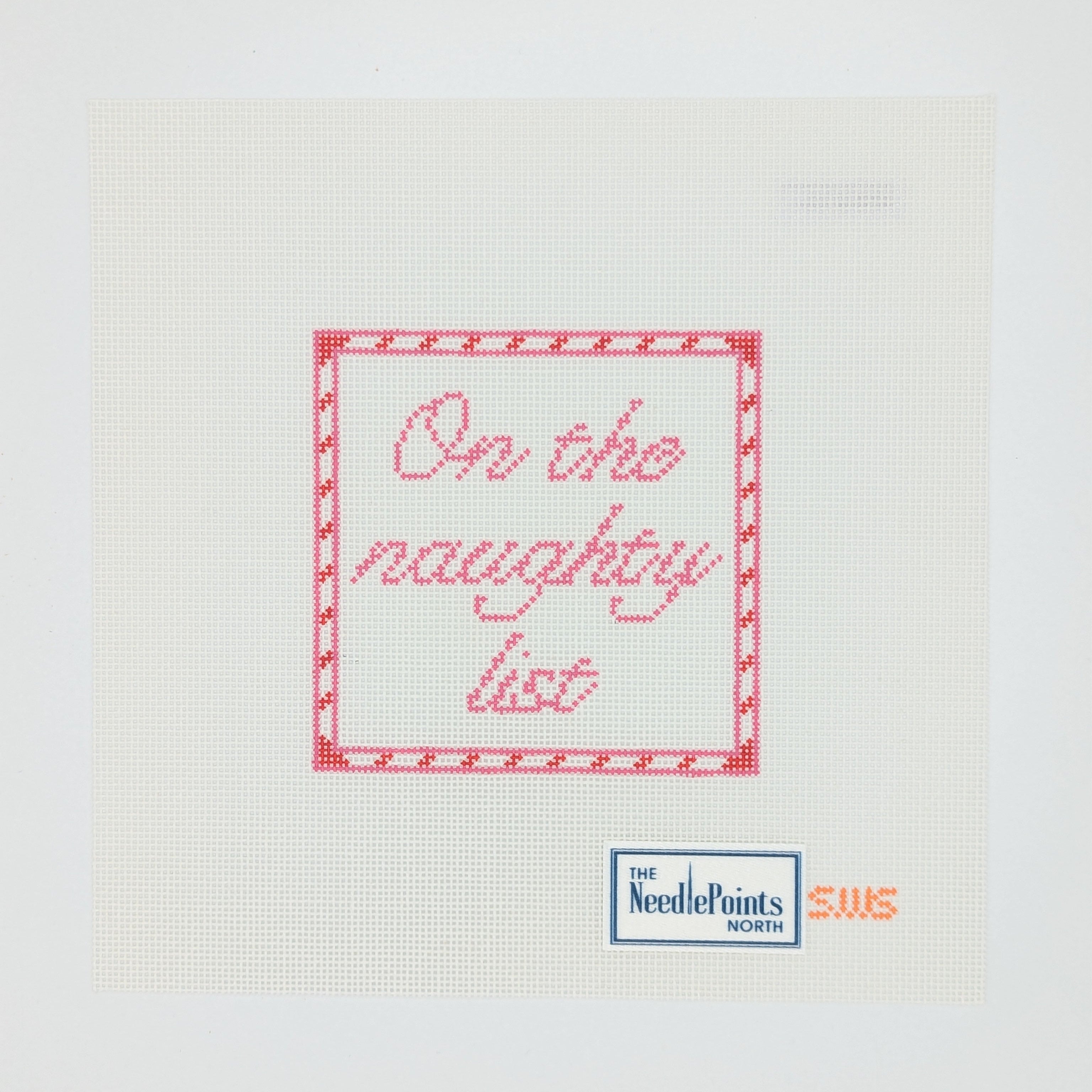 Cross-stitched message 'On the naughty list' on a white fabric with Needlepoint label.