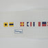 Canvas with I'd Rather Be Sailing spelled out in Flag Symbols