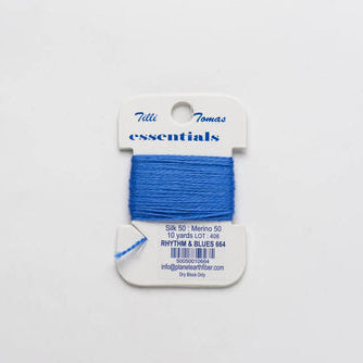 Blue thread on a Tilda essentials packaging against a white background
