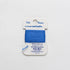 Blue thread on a Tilda essentials packaging against a white background