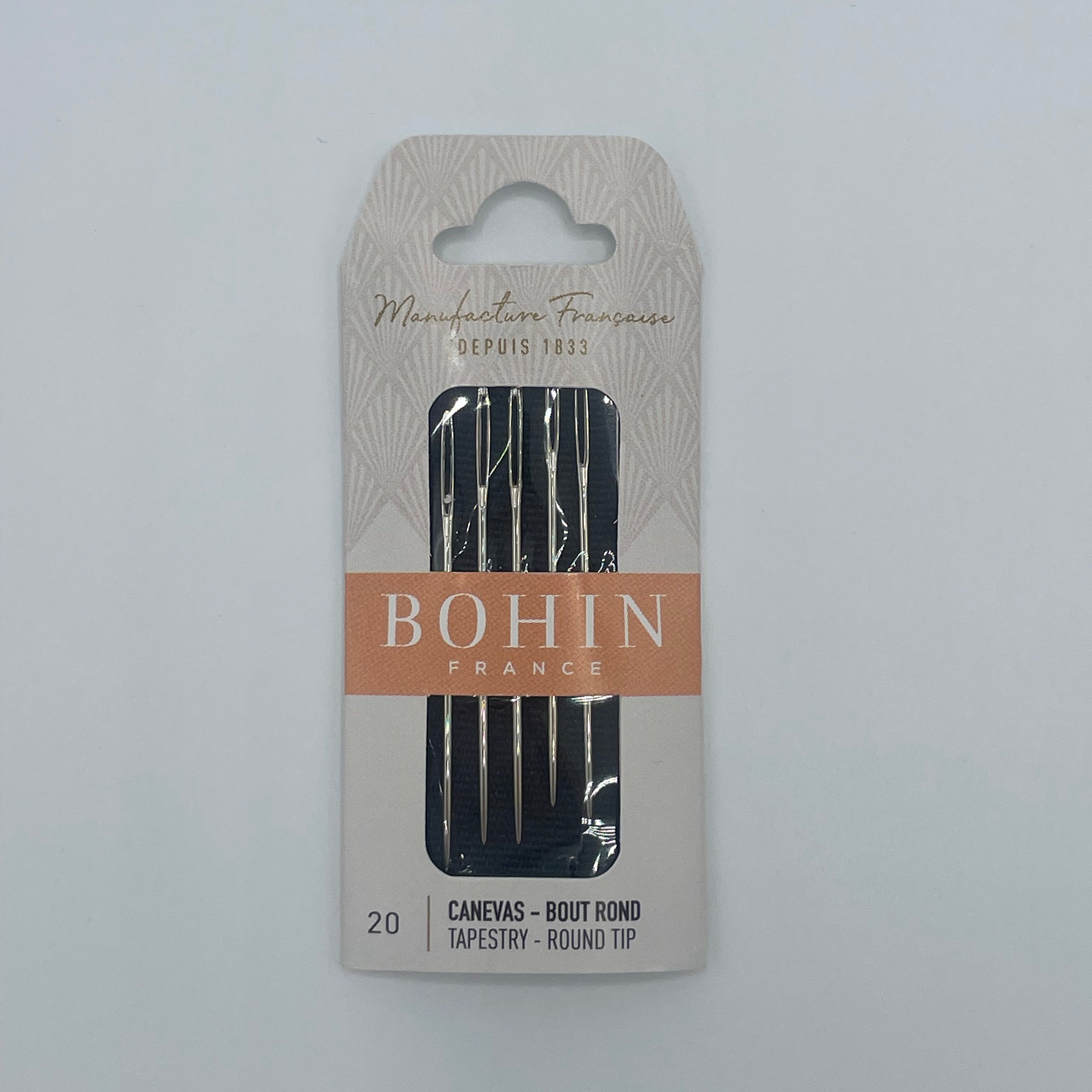 Pack of Bohin needles on a gray background