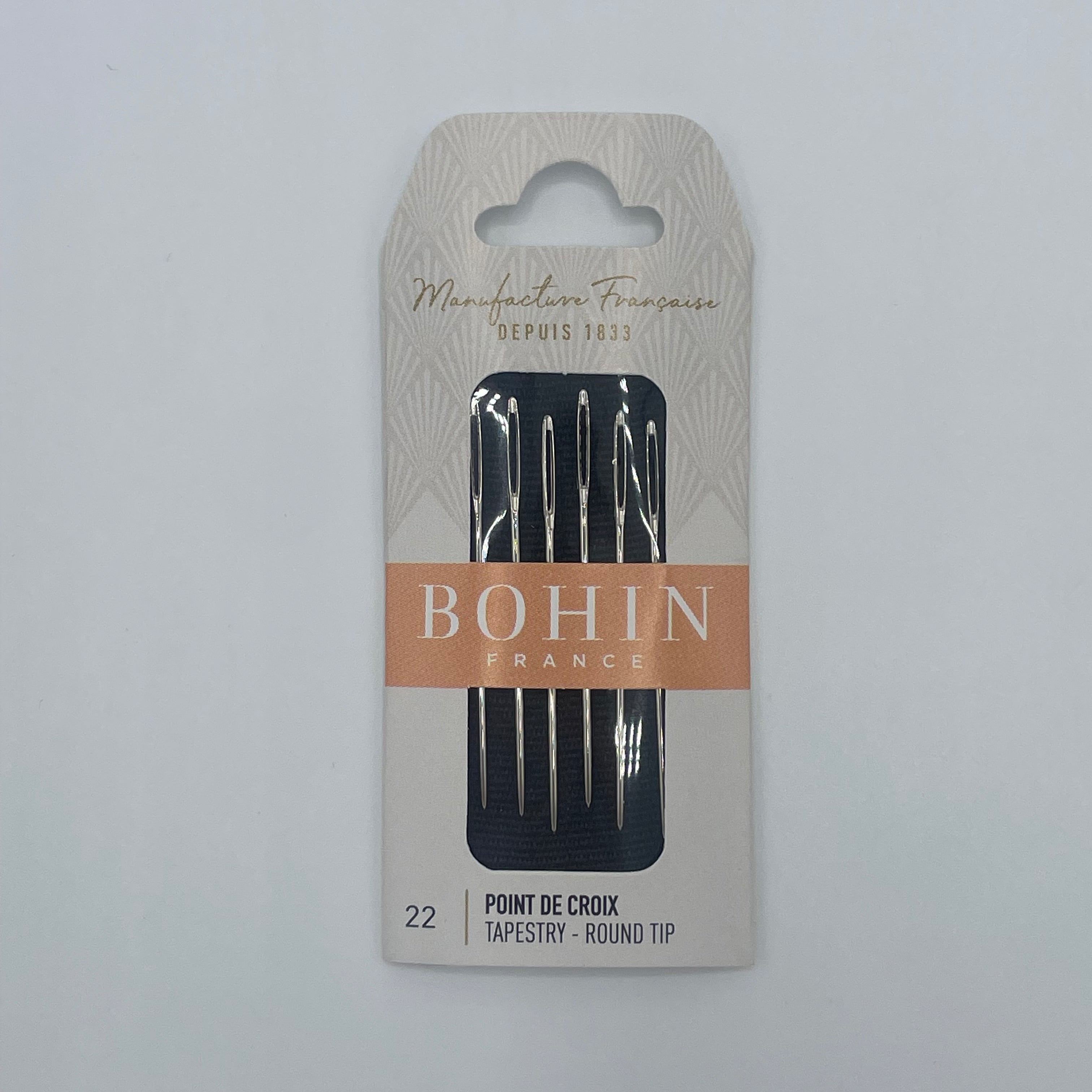 Pack of Bohin needles on a white background
