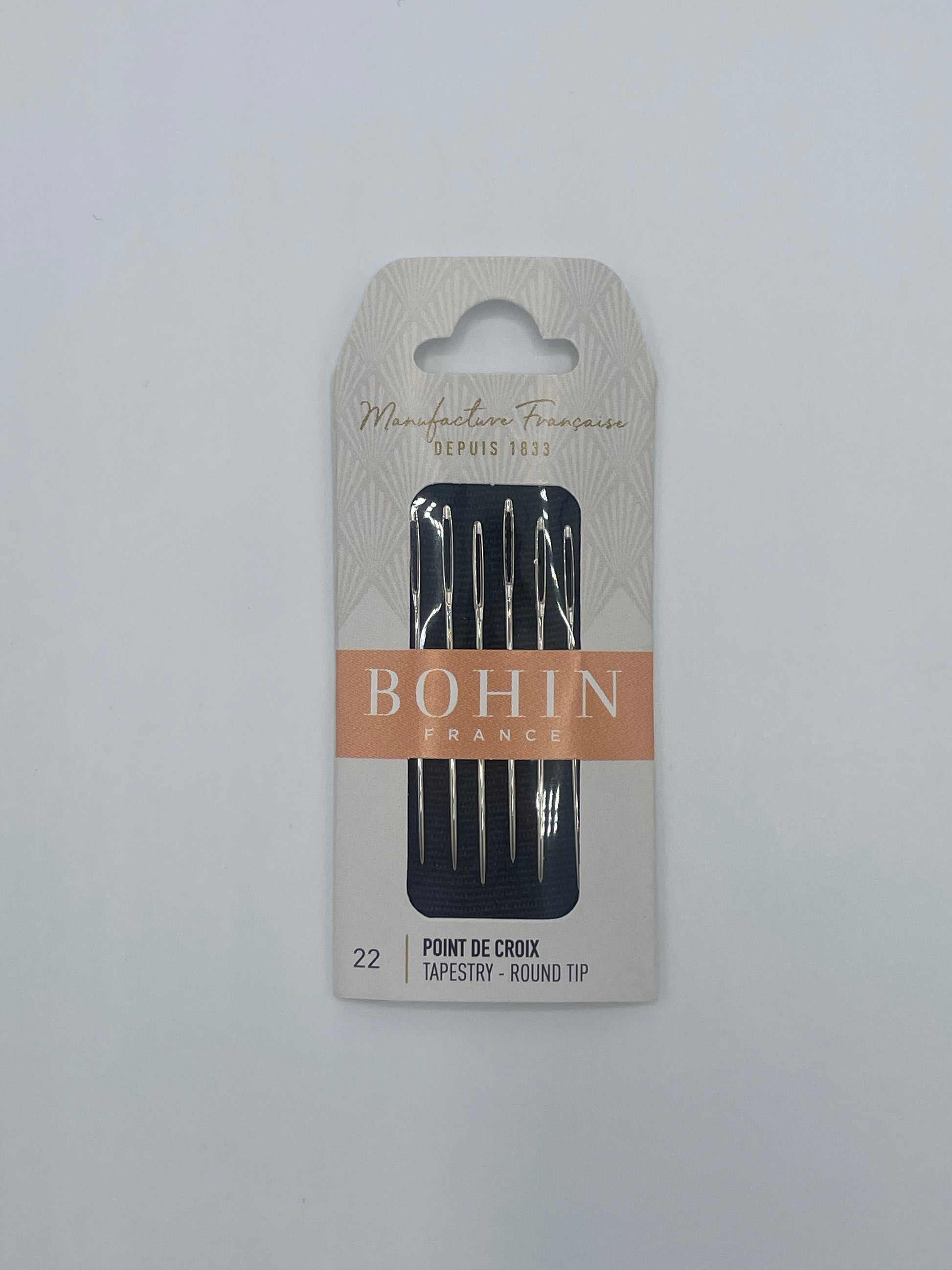 Pack of Bohin needles on a white background