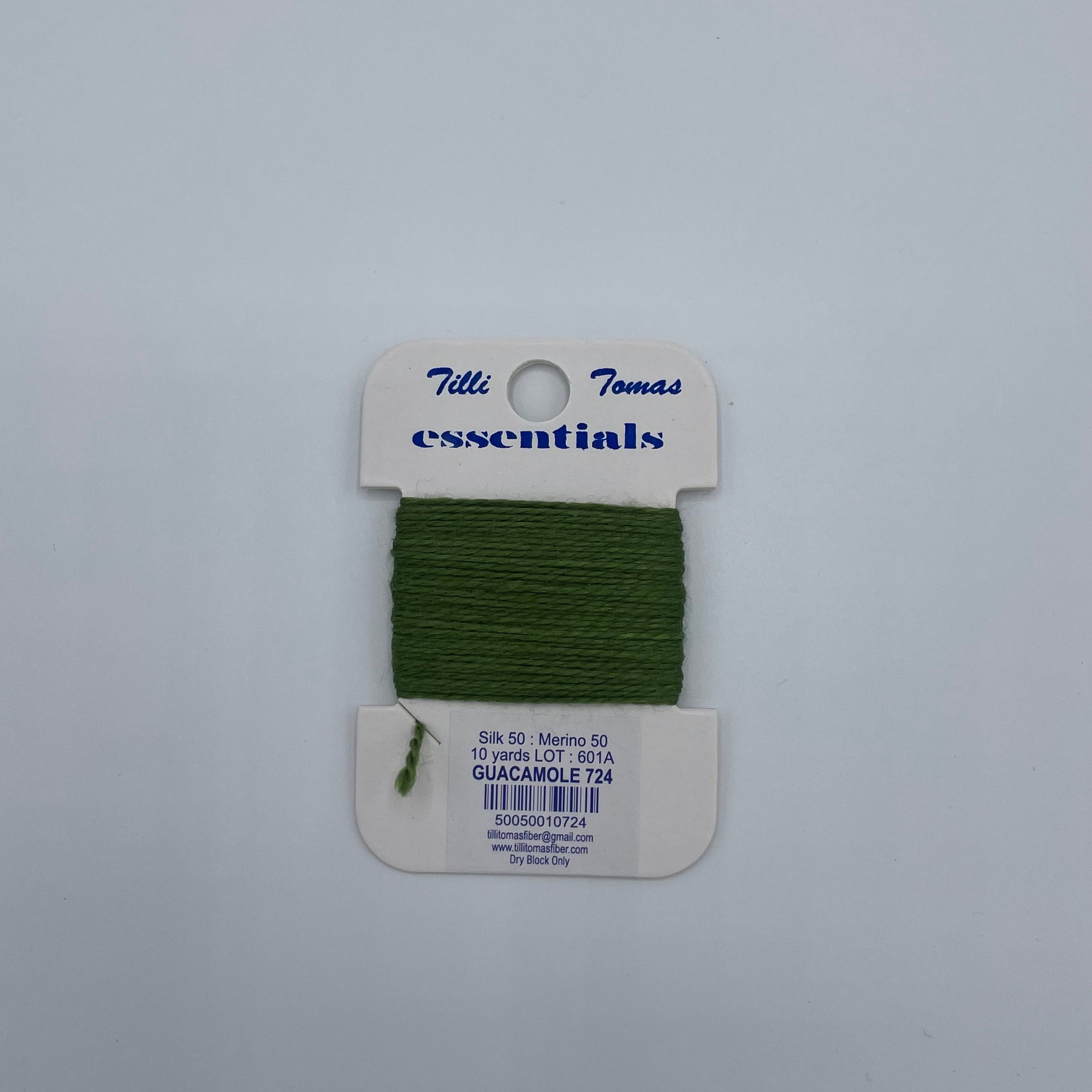 Green thread on a white card with 'Miller' branding against a light gray background