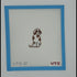 Needlepoint design of a dog on fabric with a blue border and red text.