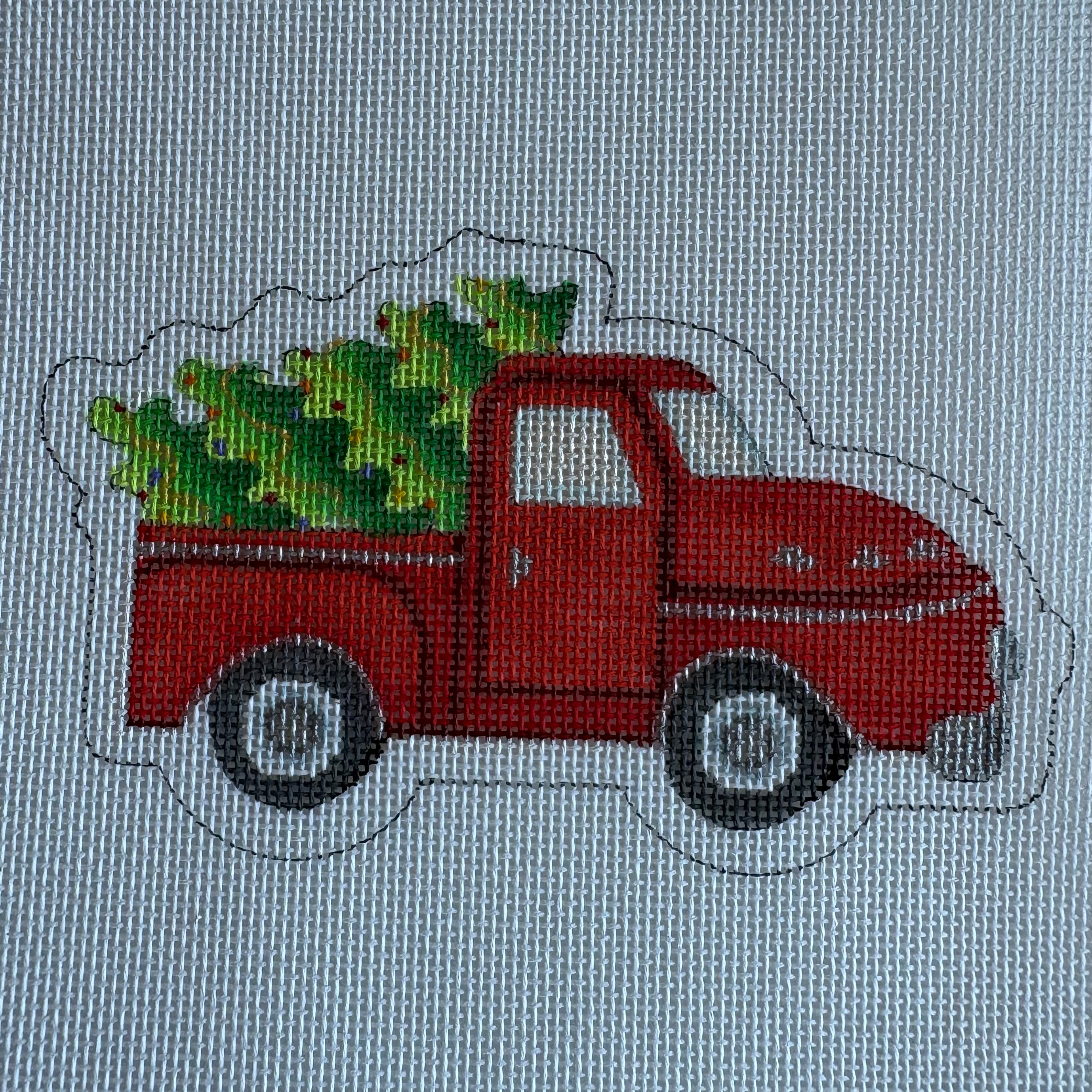 Red Pickup with Tree Ornament