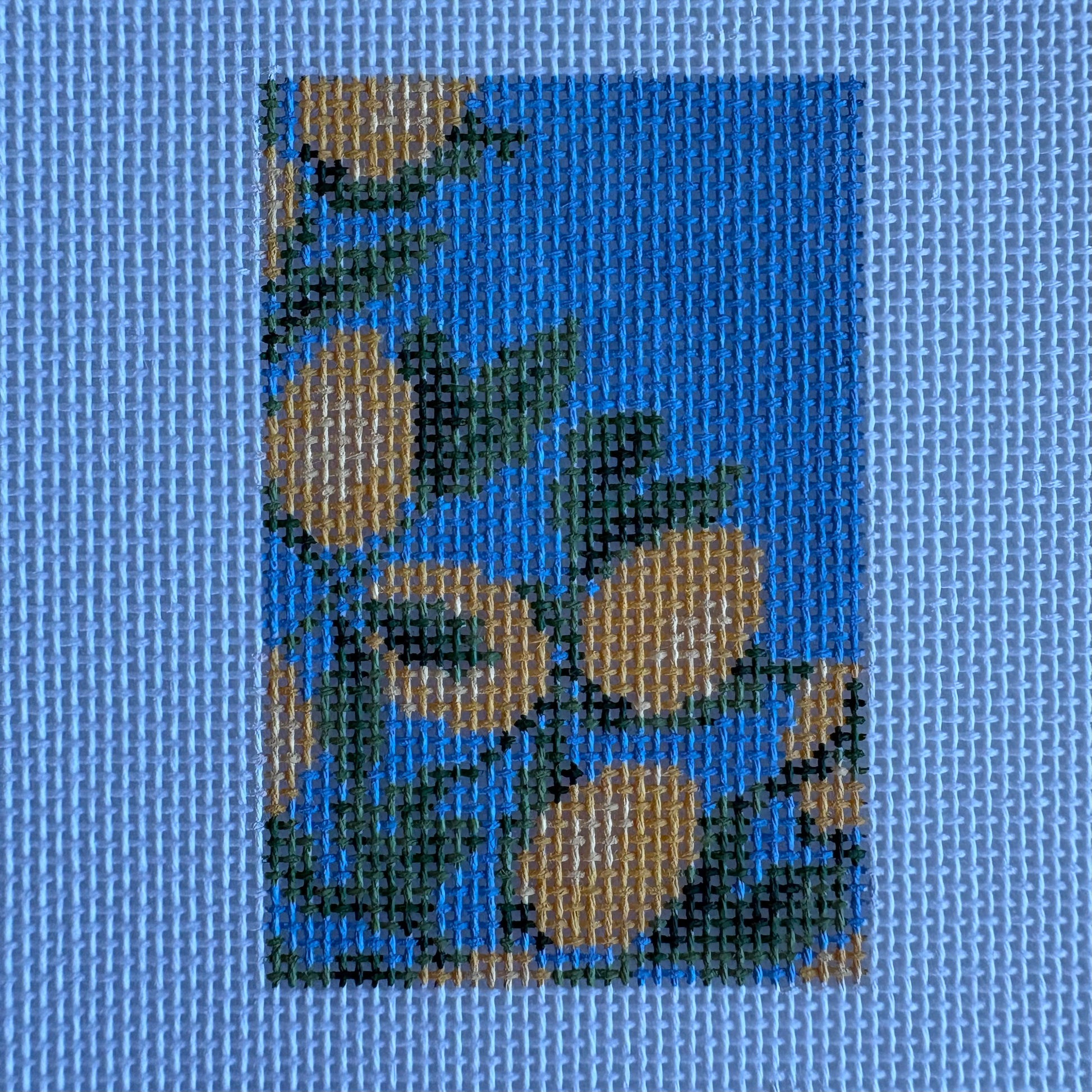 Lemons on blue luggage tag