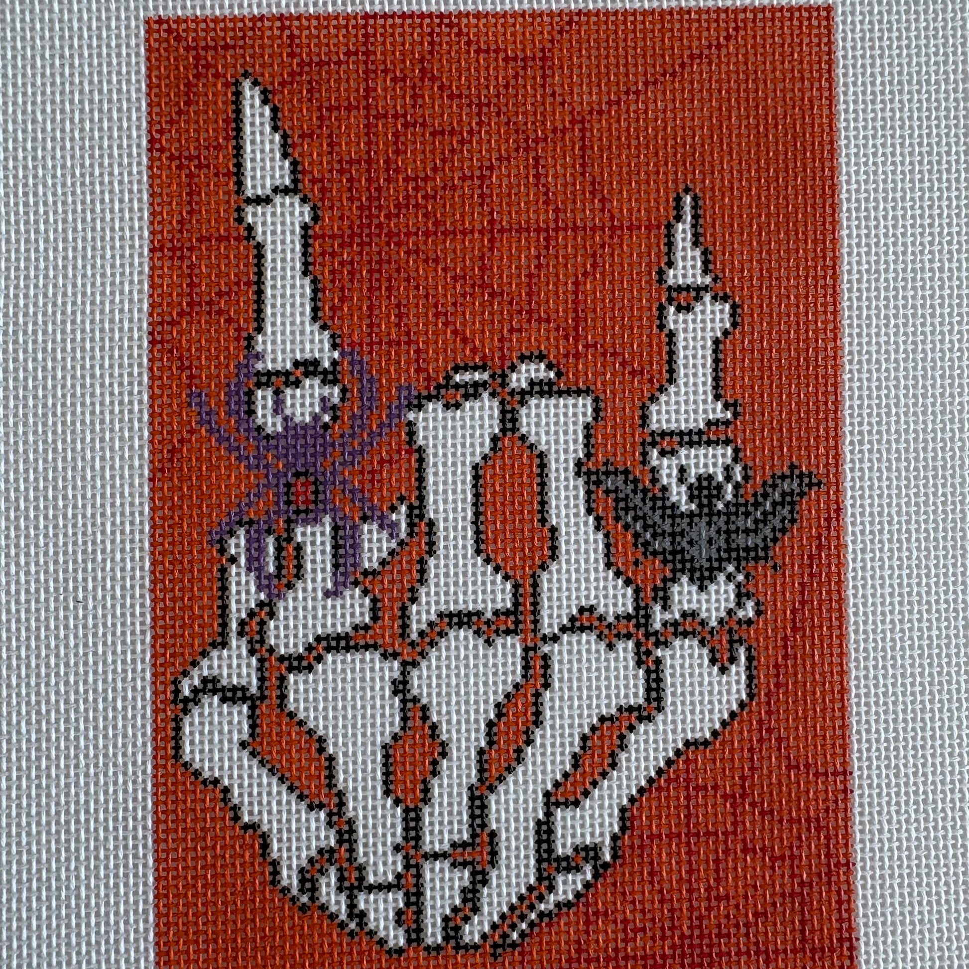 Skelton hand with spiders