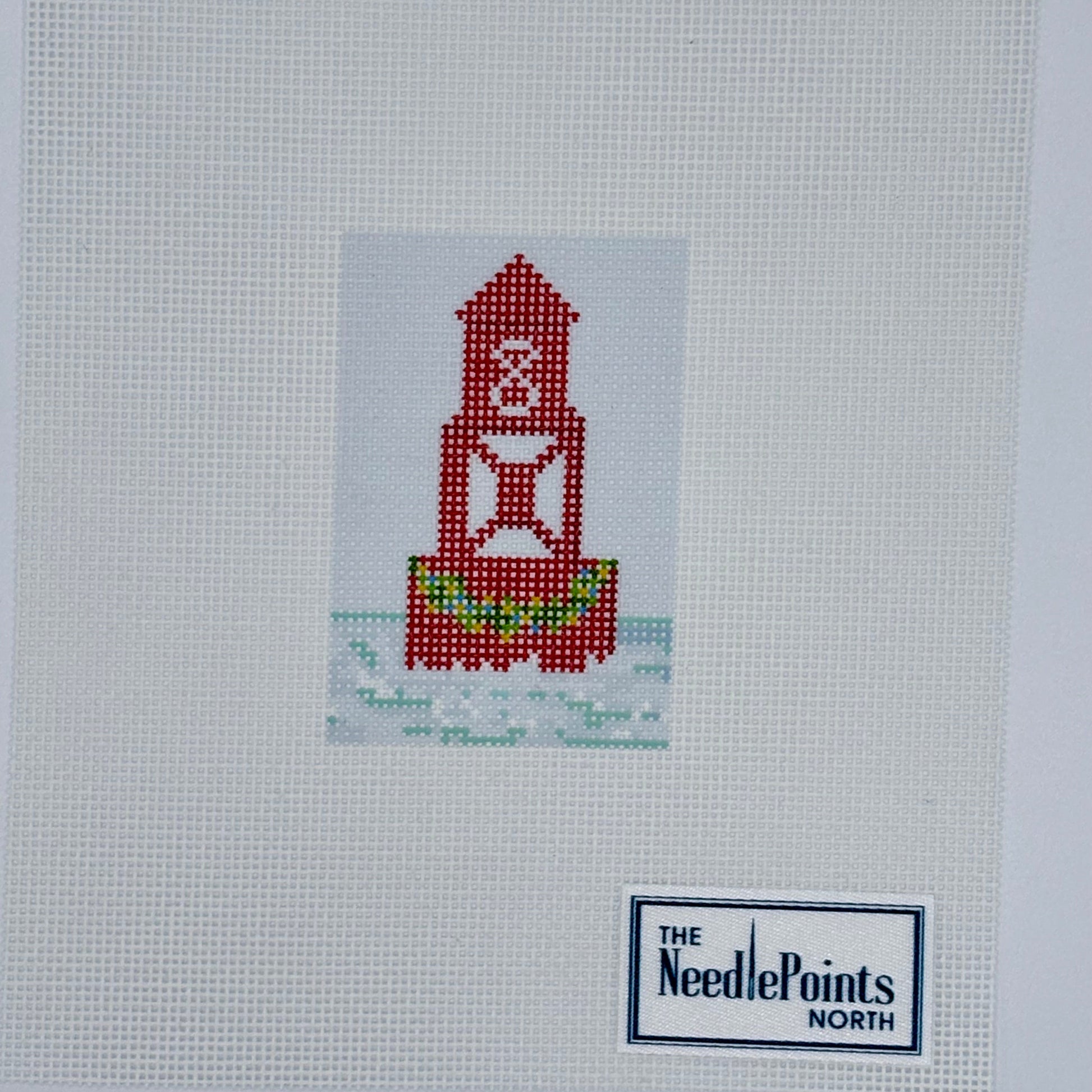 Printed canvas. Red bouy with garland in water