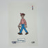 A needlepoint canvas featuring a pixelated depiction of the character 'W' from 'The Needlepoints of Hollywood' wearing his signature red and white striped shirt, blue pants, and brown shoes, with 'PENNY CARR' and 'LDD' printed below.