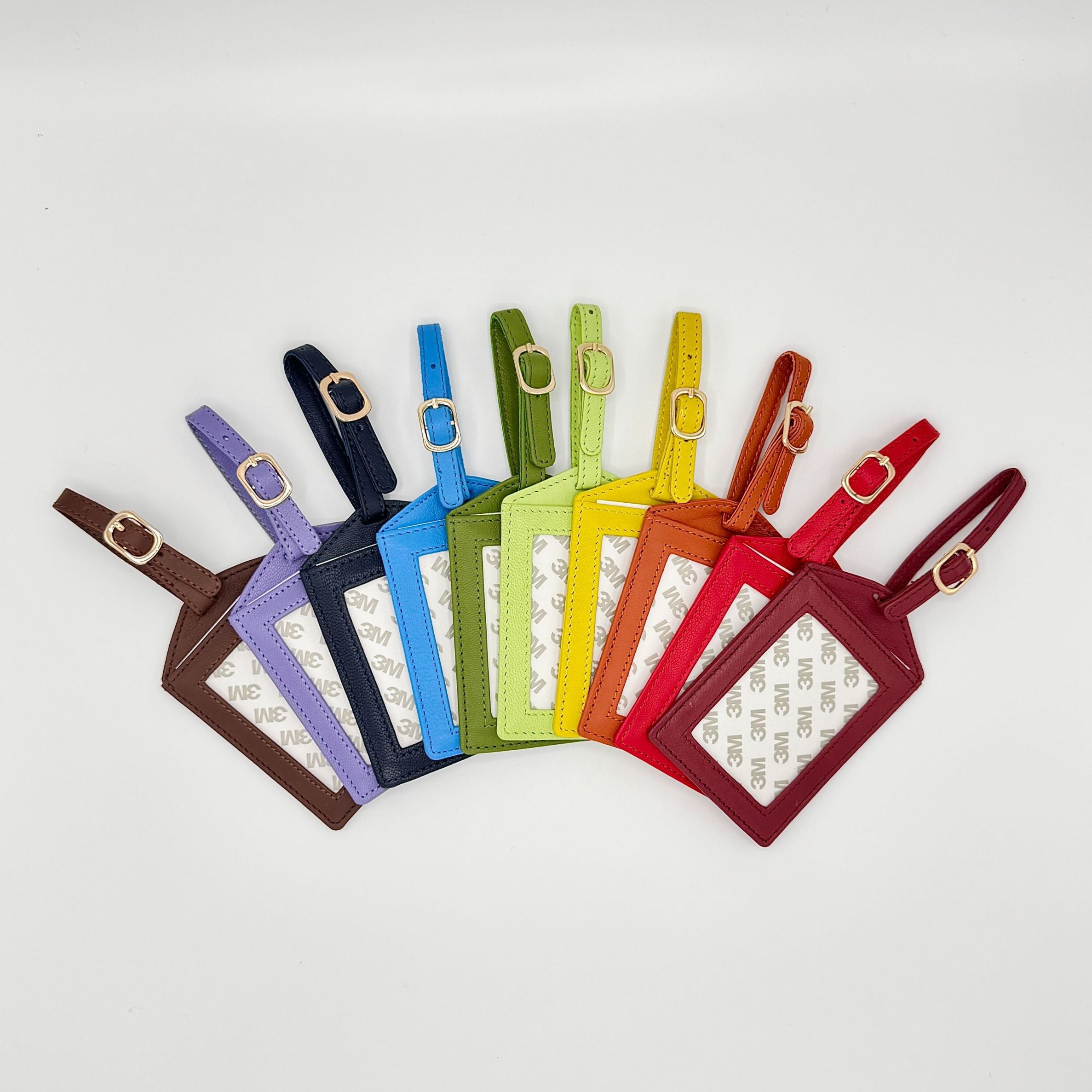 Set of colorful luggage tags arranged in a circular pattern on a light gray background.