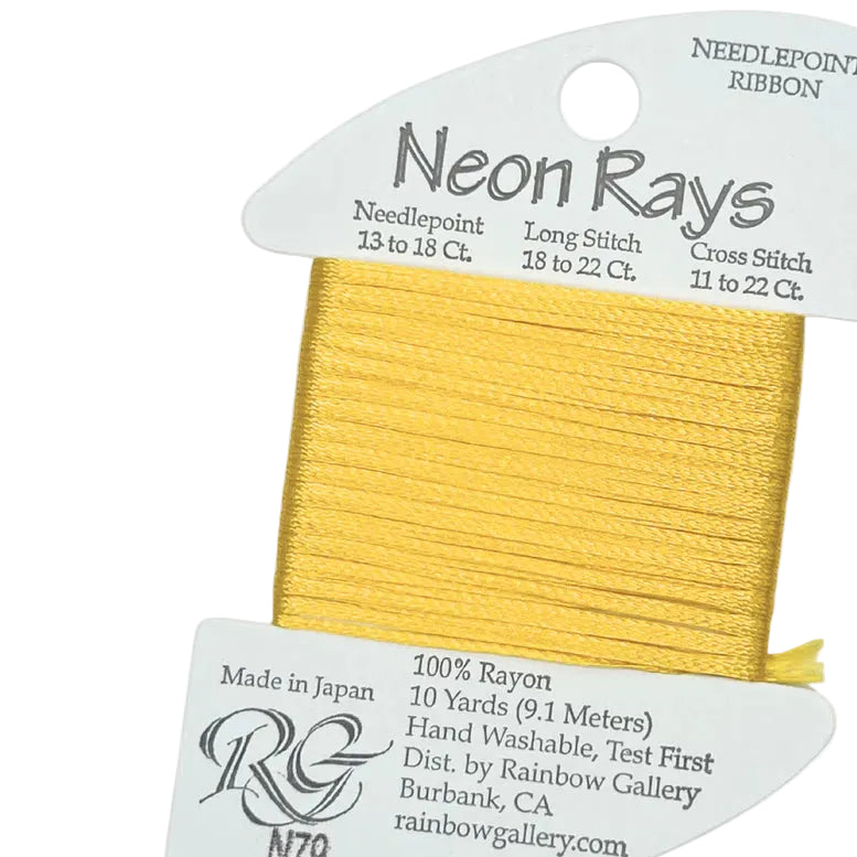 Neon Rays needlepoint ribbon in gold color with packaging on a white background