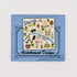 A small square blue card or label featuring a Paris-themed illustrated map design with the text 'Paris' and 'Accompanied Designs' on a plain white background.