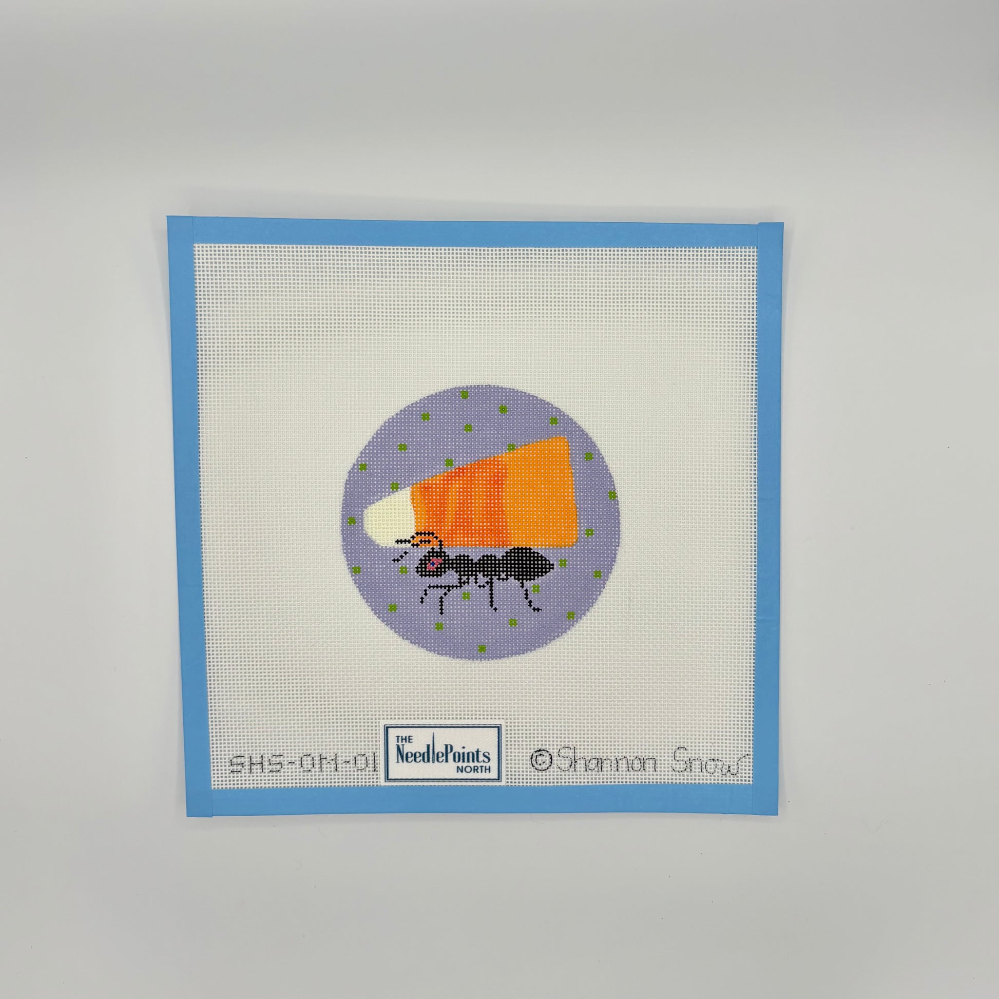 Ant carrying candy corn