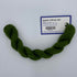 Green skein of yarn with a label on a white background